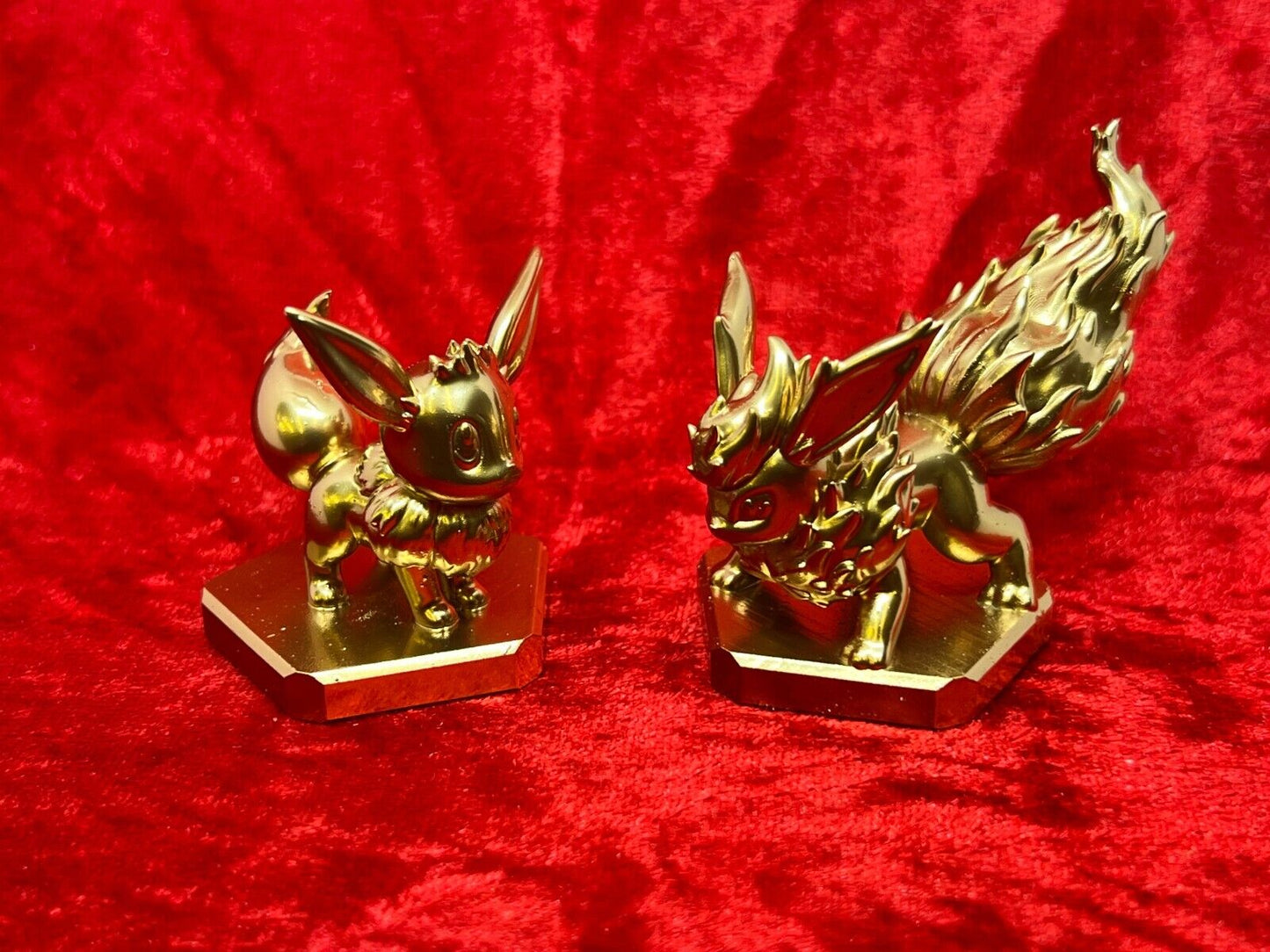 Pokemon #133 Eevee and #136 Flareon figure Gold TCG Statue