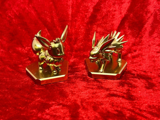 Pokemon #133 Eevee and #135 Jolteon figure Gold TCG Statue