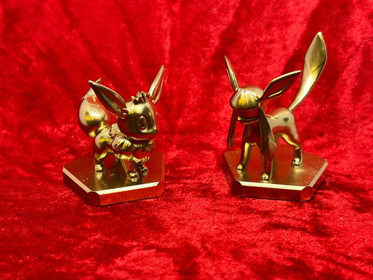 Pokemon #133 Eevee and #471 Glaceon figure Gold TCG Statue