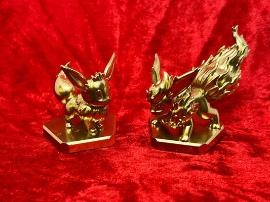 Pokemon #133 Eevee and #136 Flareon figure Gold TCG Statue